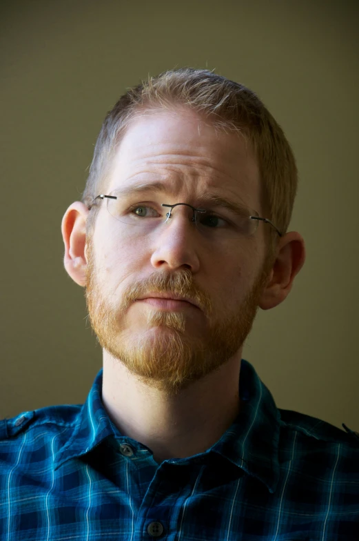 a man with glasses and a red beard