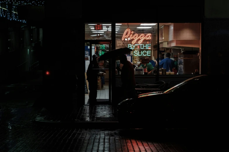 dark street and the entrance to a restaurant