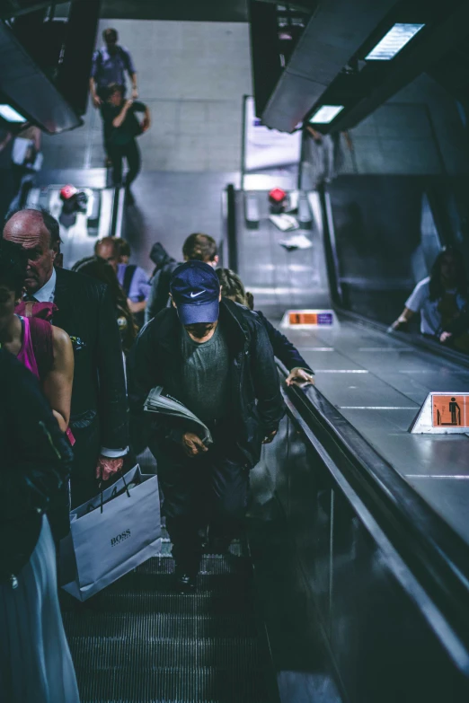 a man in a mask going down an escalator