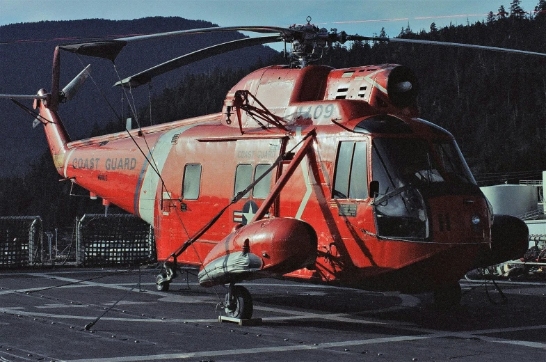 the large helicopter is parked in the lot