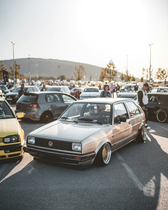 an old timey vehicle parked in a parking lot