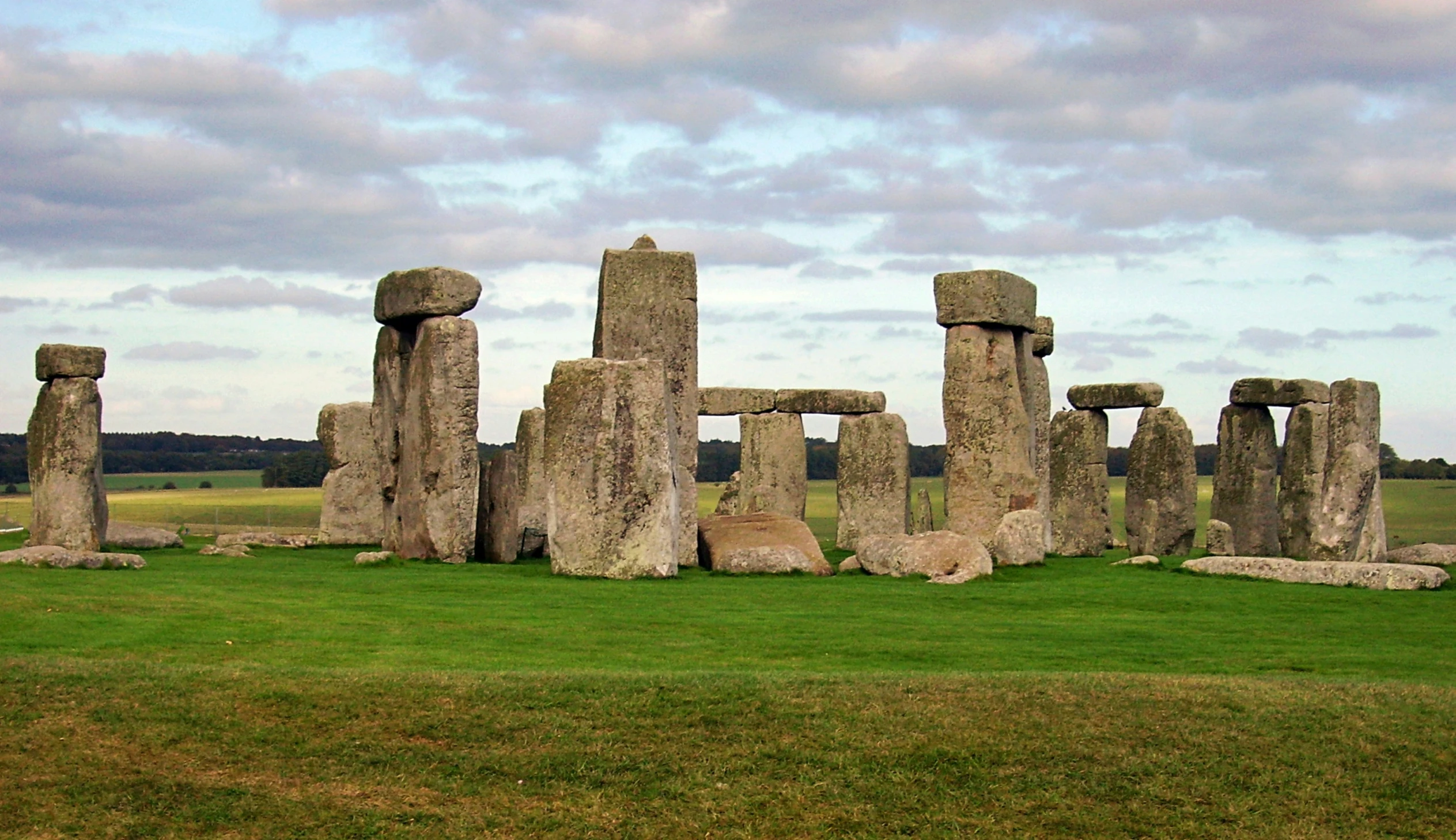 the stones are arranged in a row with grassy field below