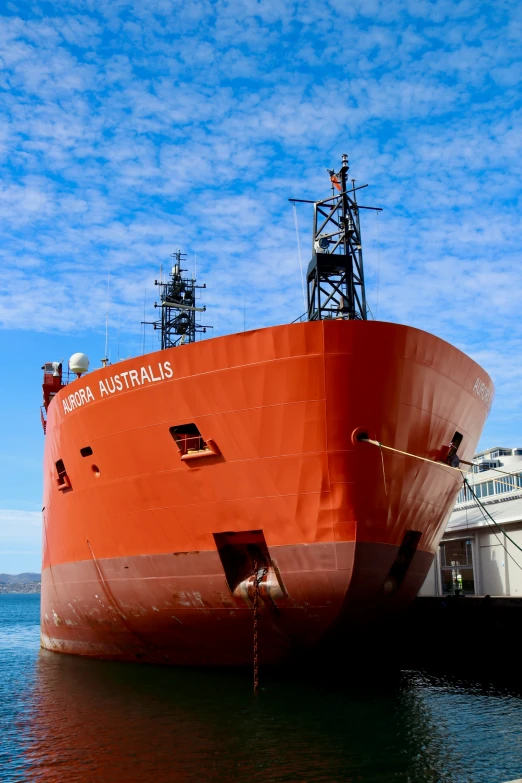 large cargo ship docked at a dock in the ocean