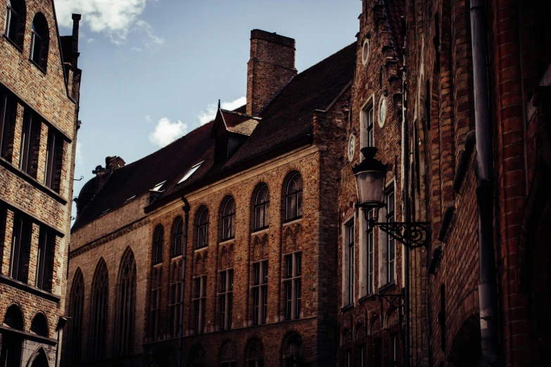 old brick buildings with a flag on top