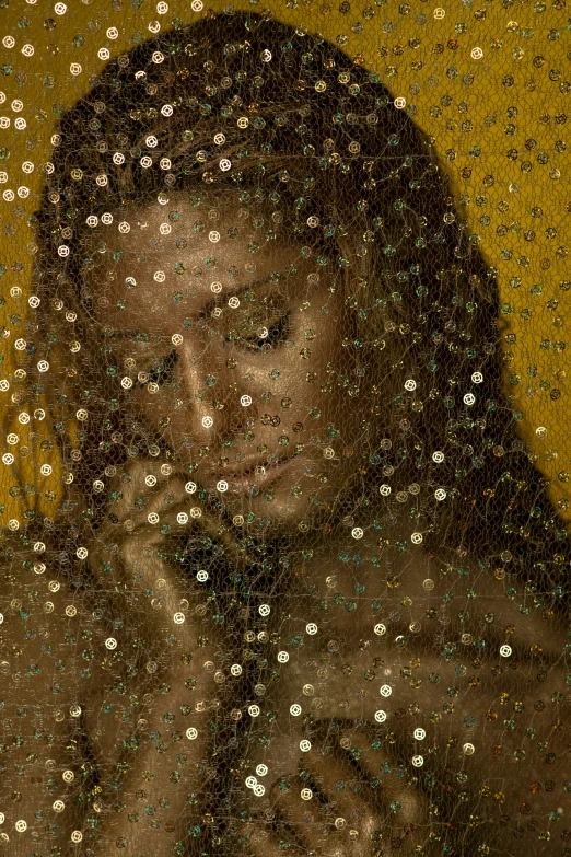 an artistic image of a woman's reflection with gold dots