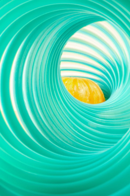 a yellow banana sits inside of a blue object