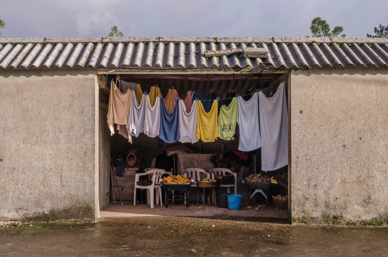 the door is open to reveal clothes hung out