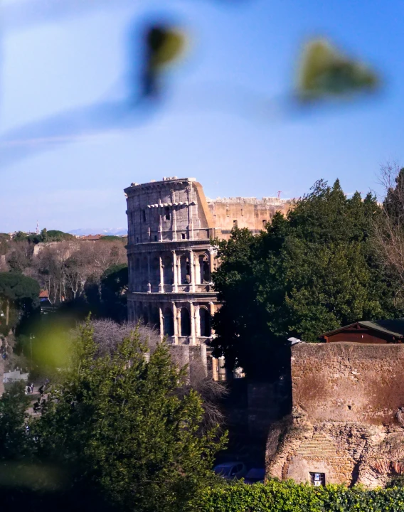 the ruins of a roman ampel, with trees in front