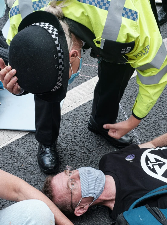 a person lying down with their head placed on the ground