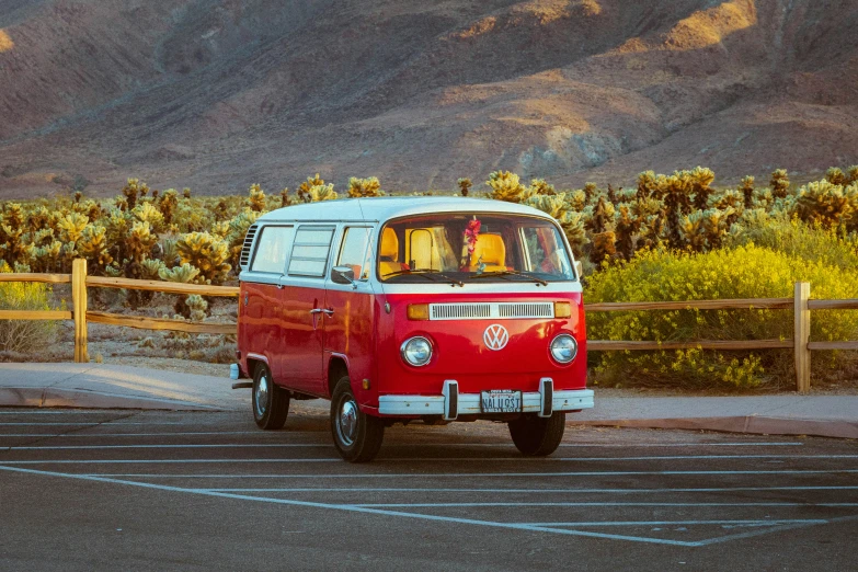 a red and white van with a dog in the front window