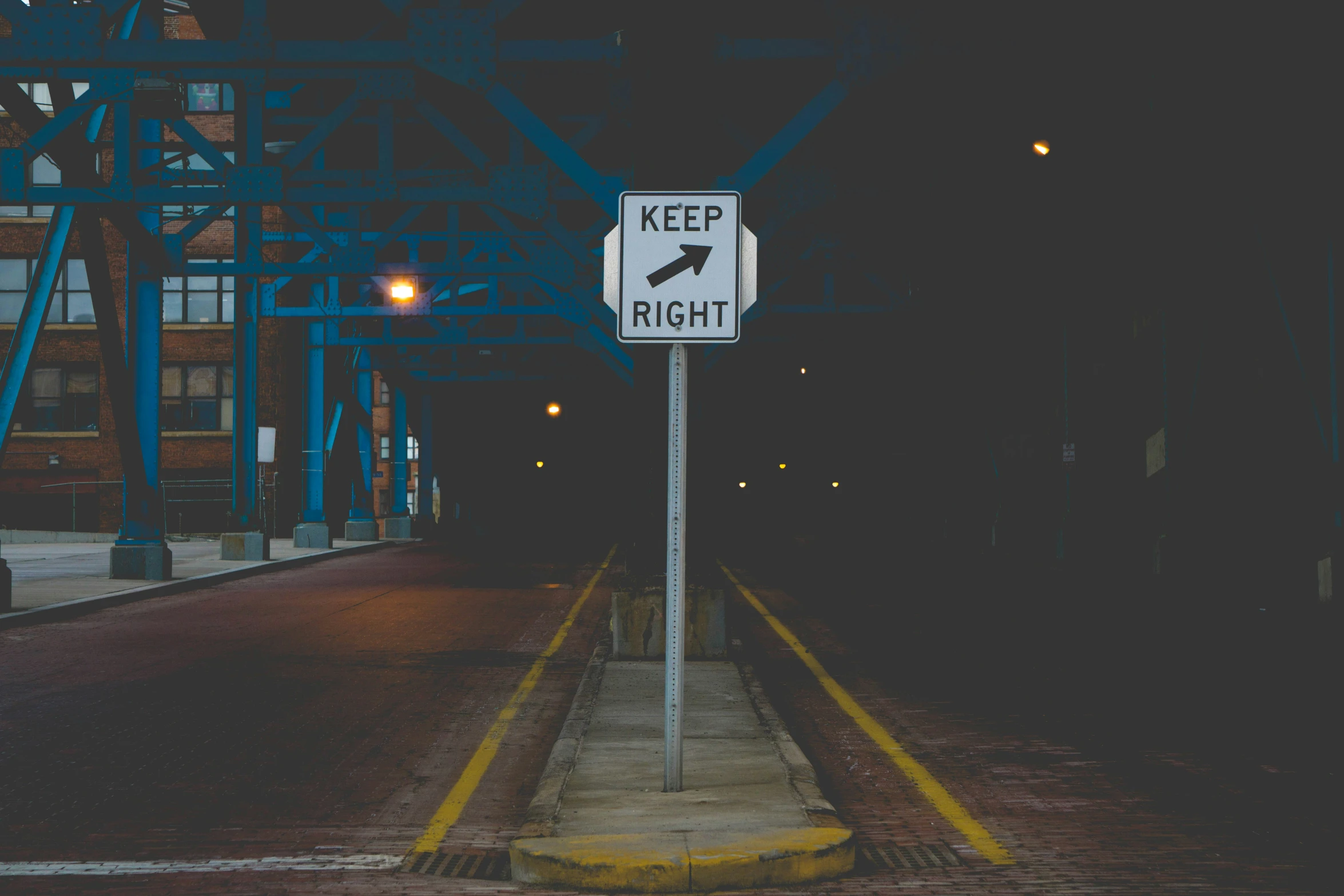 a street sign is on the side of a road