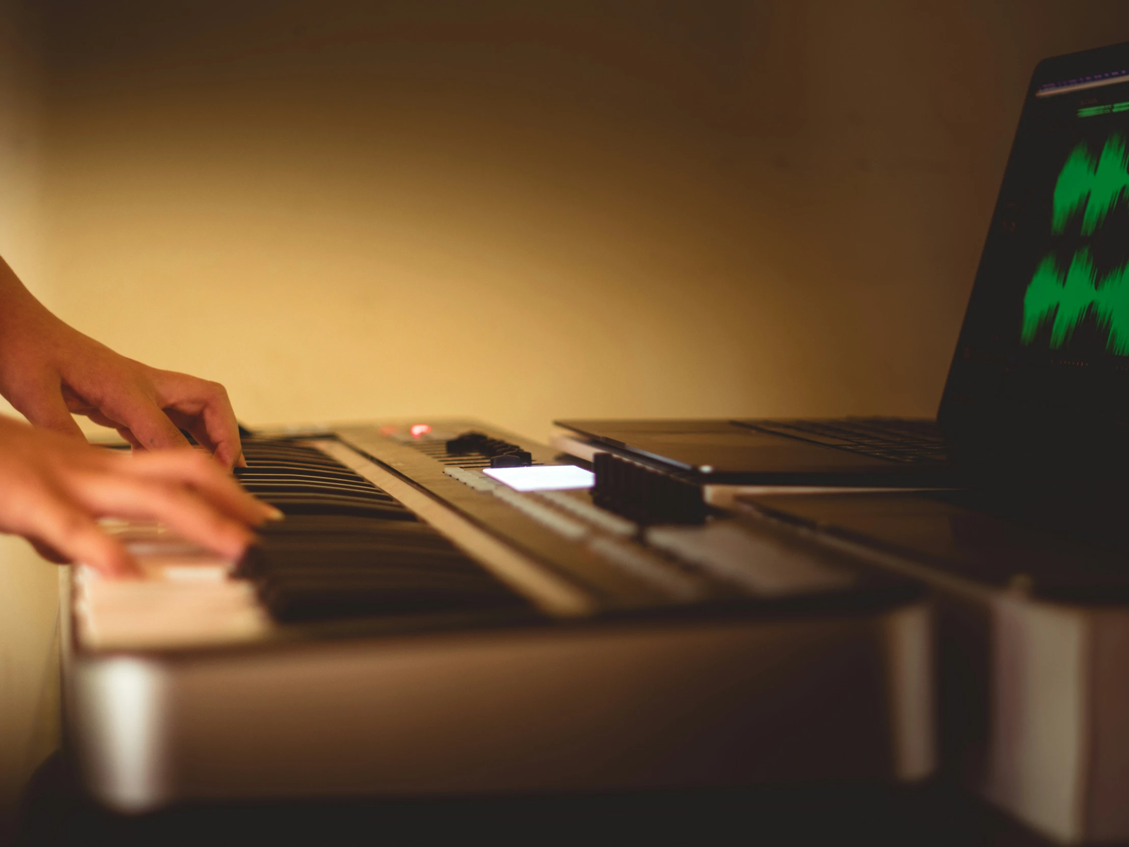 a person is typing on a laptop with their hands