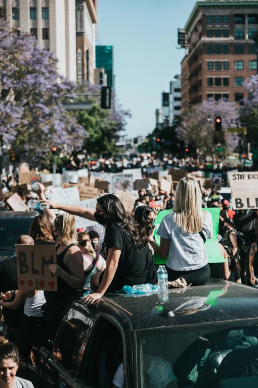 a group of people gathered together in a crowded street