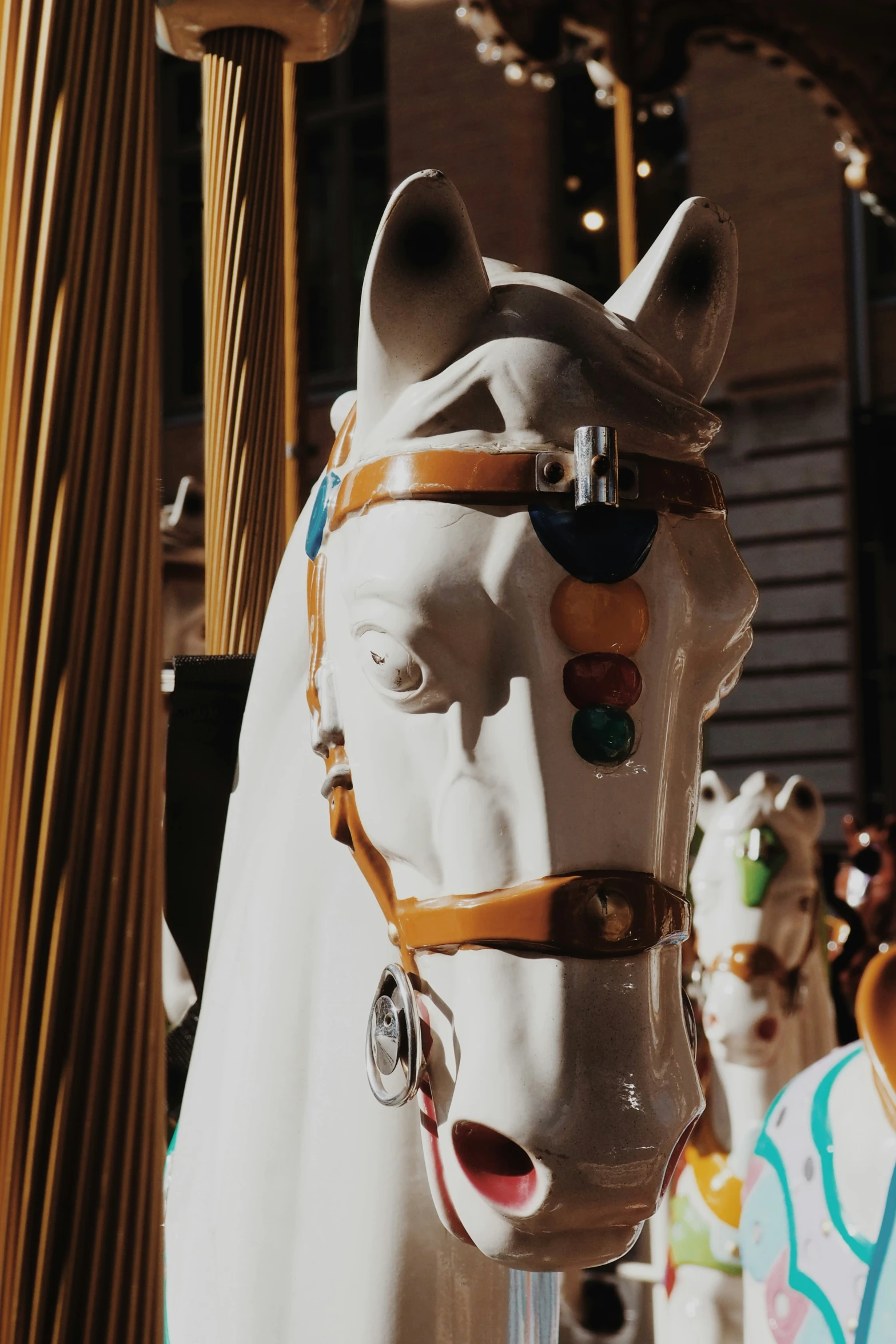 an ornate head horse is mounted to a pole