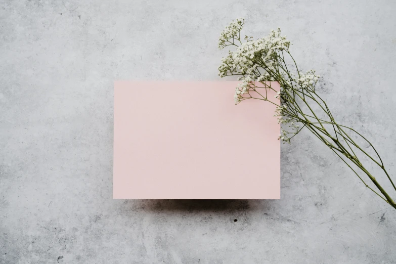 pink note and flowers with an empty pink card on the side