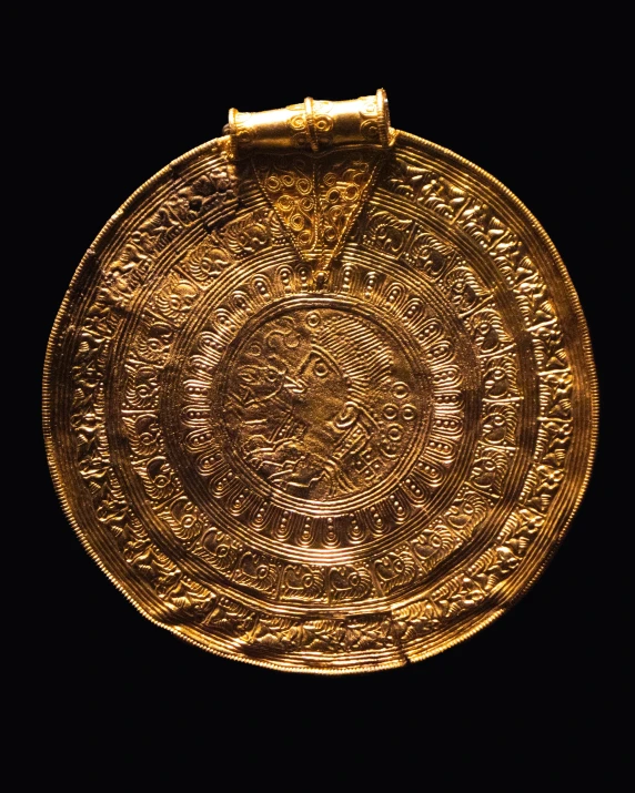 an old, gold plate from the time when ancient people used it