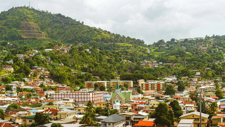 this is an aerial view of a small town with the mountain in the background