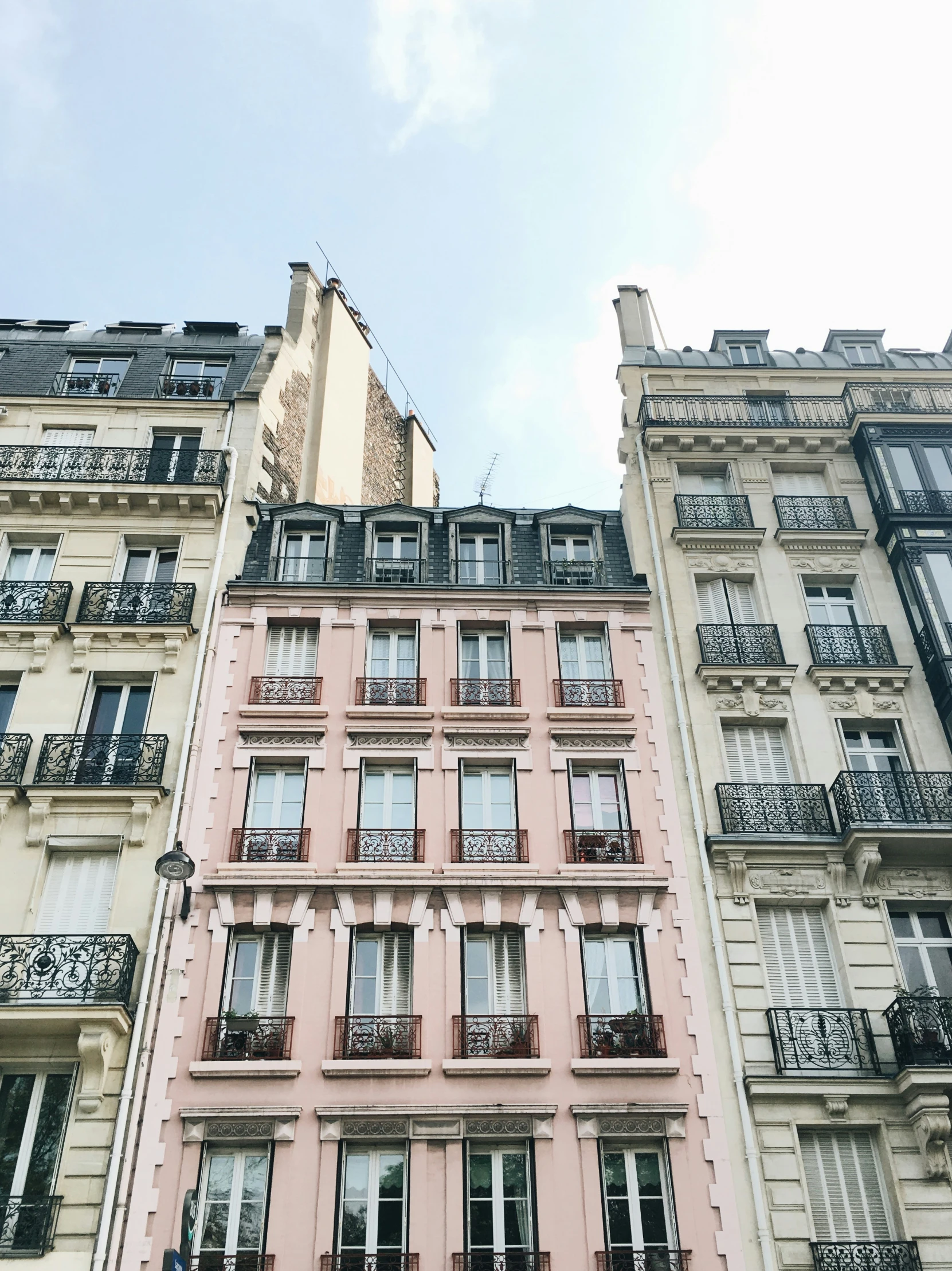 a couple of tall building that have balconies