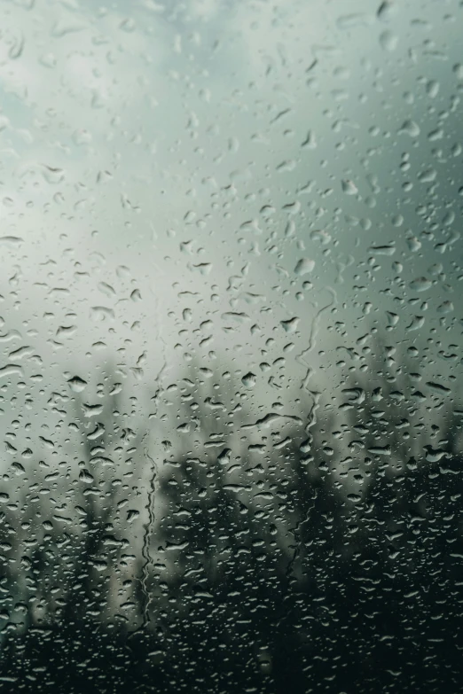 rain drops on a car windshield during the day