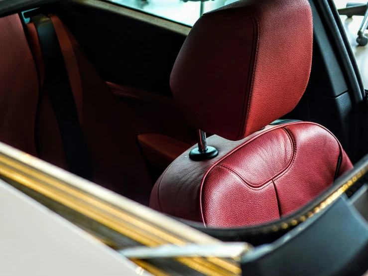 an interior view of a modern car with red leather