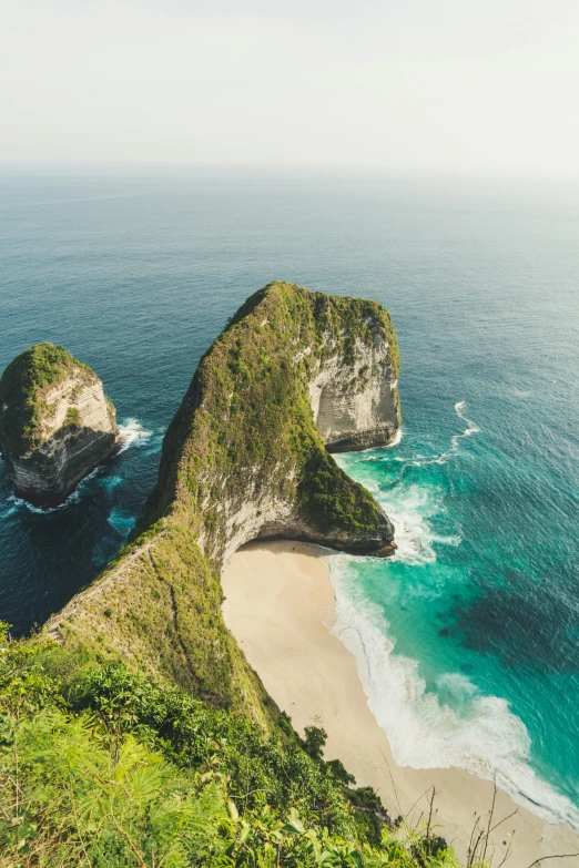 view of an ocean coastline from a hill