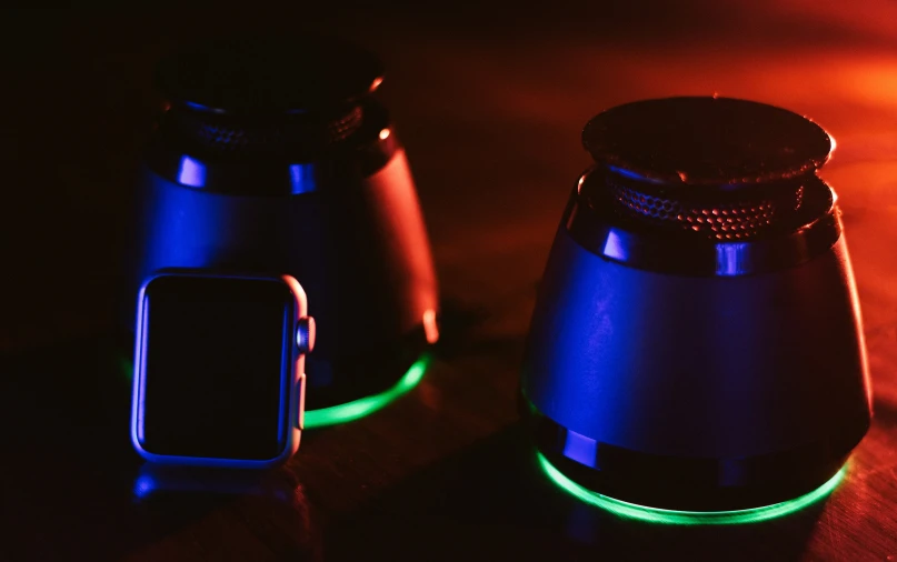 two light up objects sitting on top of a table