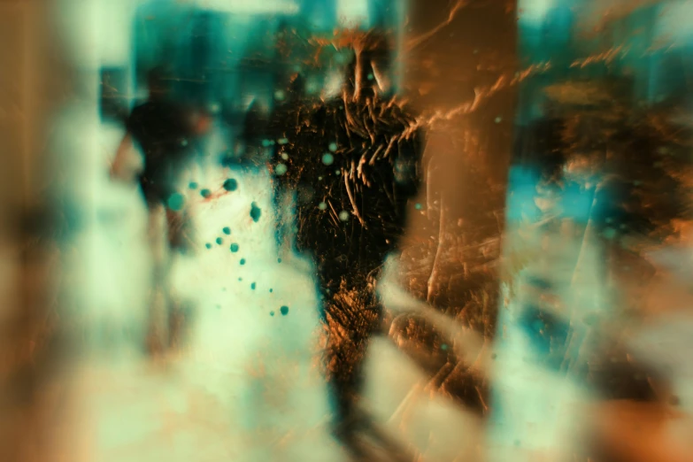 an abstract image of people walking outside with a blurry background