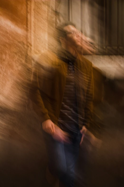 a blurry pograph of an abstract man walking on street