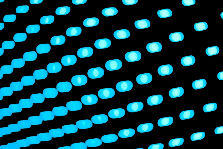 blue circles of glowing light against a black background