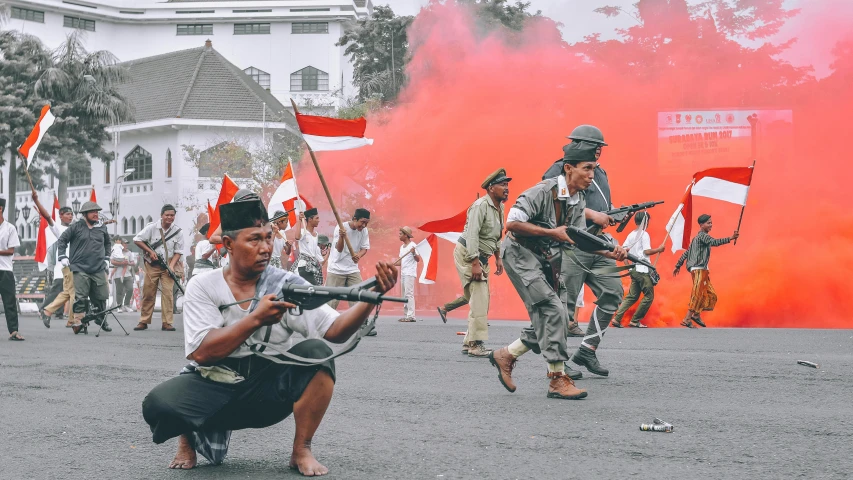 an image of men with guns in the street