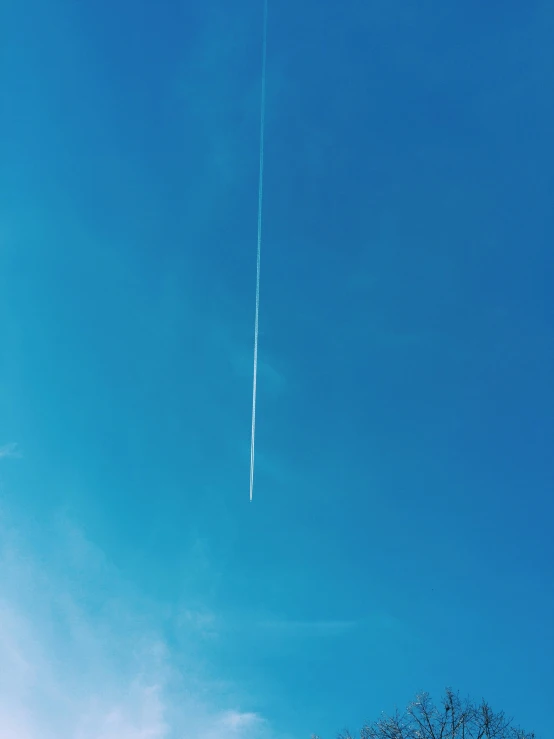 a plane is in the sky as seen from below