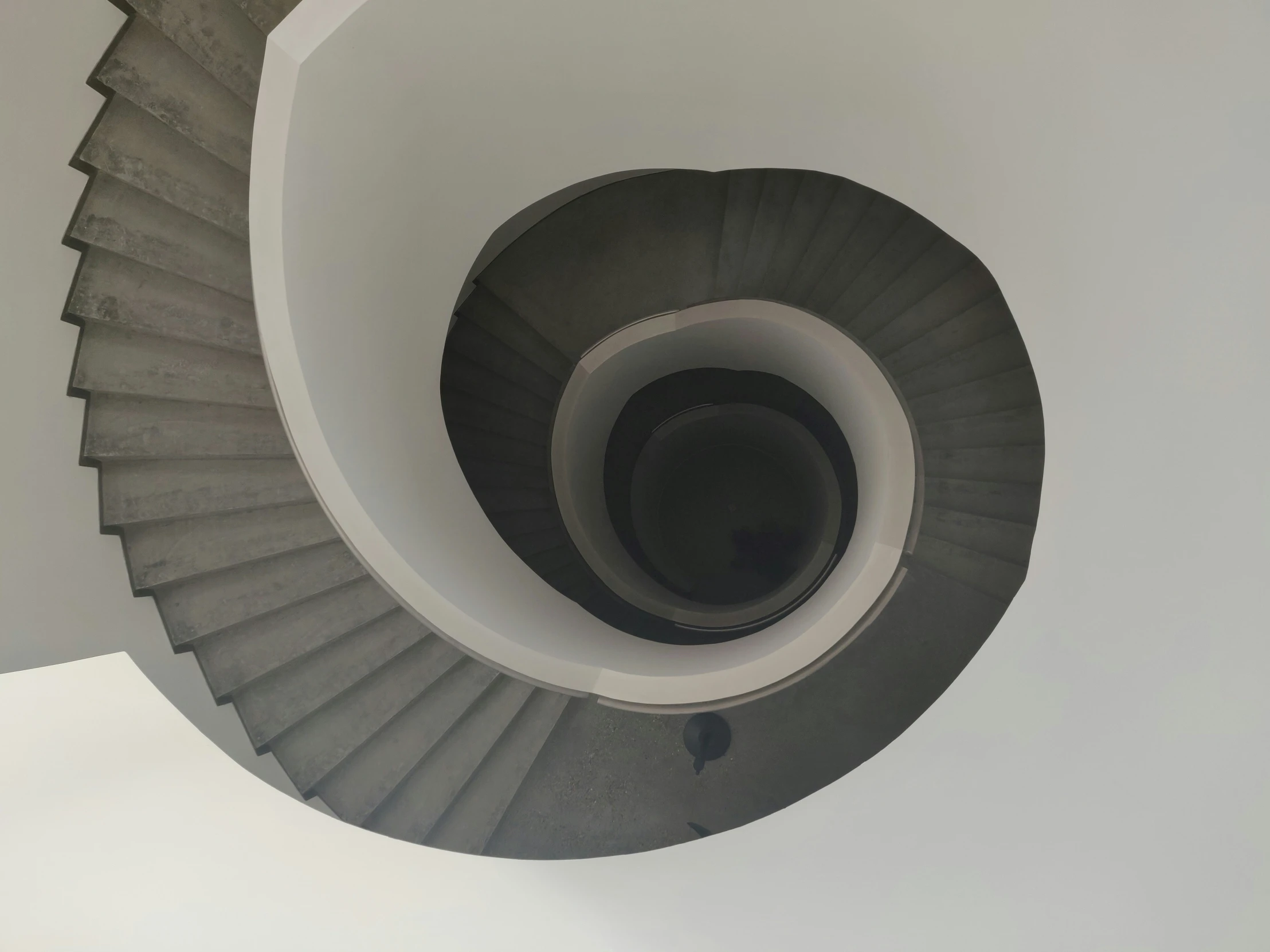 a black and white image of a very tall stair