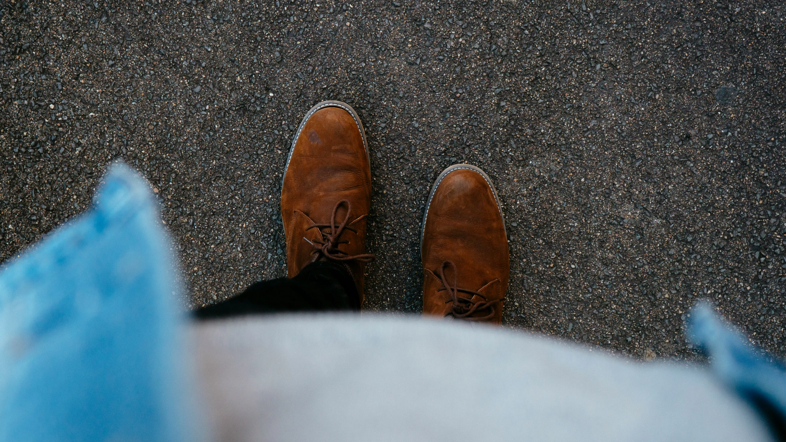 a close up of a man's feet wearing shoes