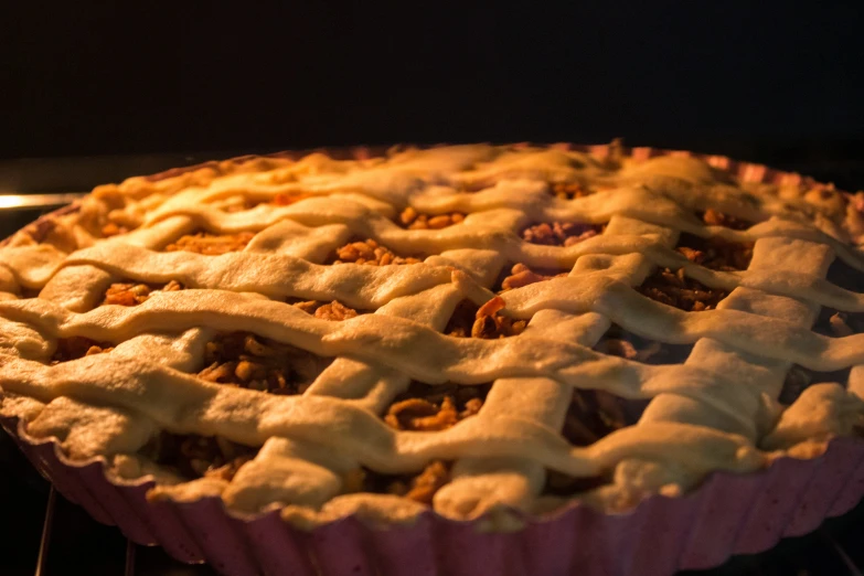 a pie baking in an oven on top of a rack