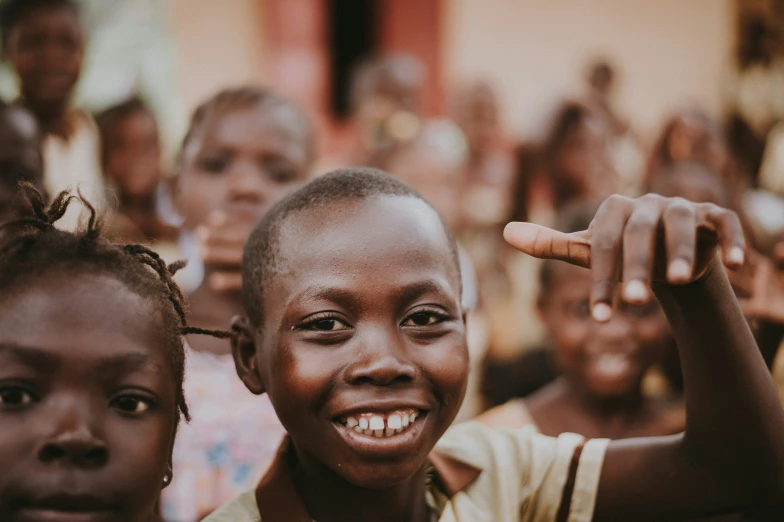 two smiling children standing next to each other