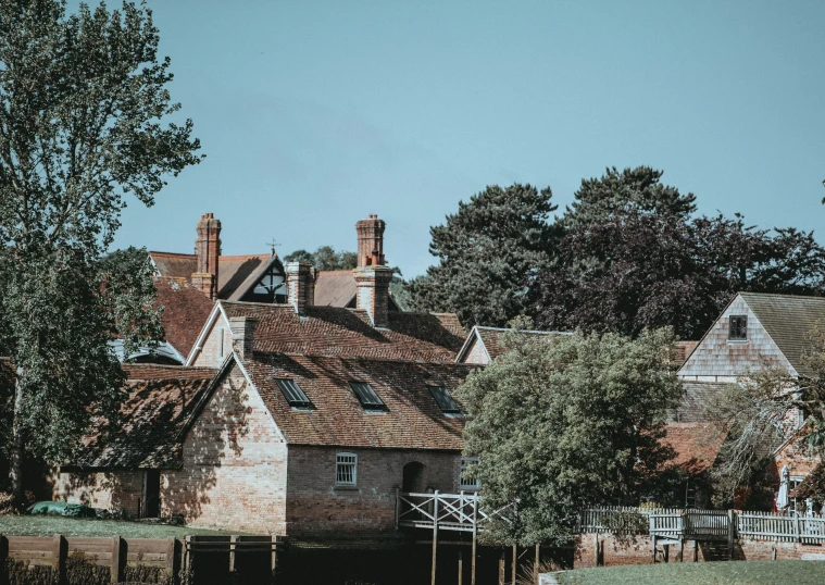 the buildings are beside each other near a few trees