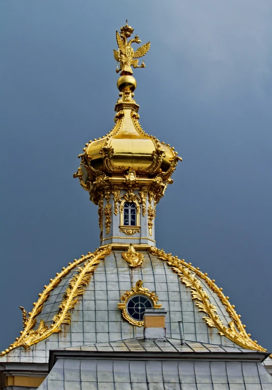 the golden clock is displayed on top of the building