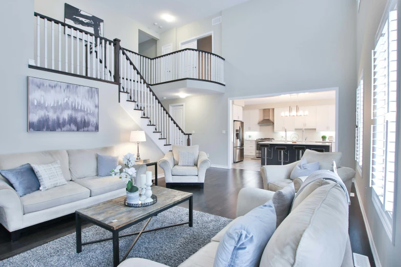 the interior of a modern home with stairs leading to the foyer