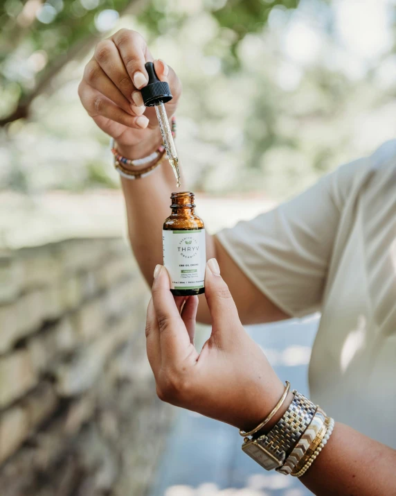 an image of a person holding an essential oil