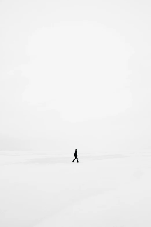 a person walking through the snow covered ground