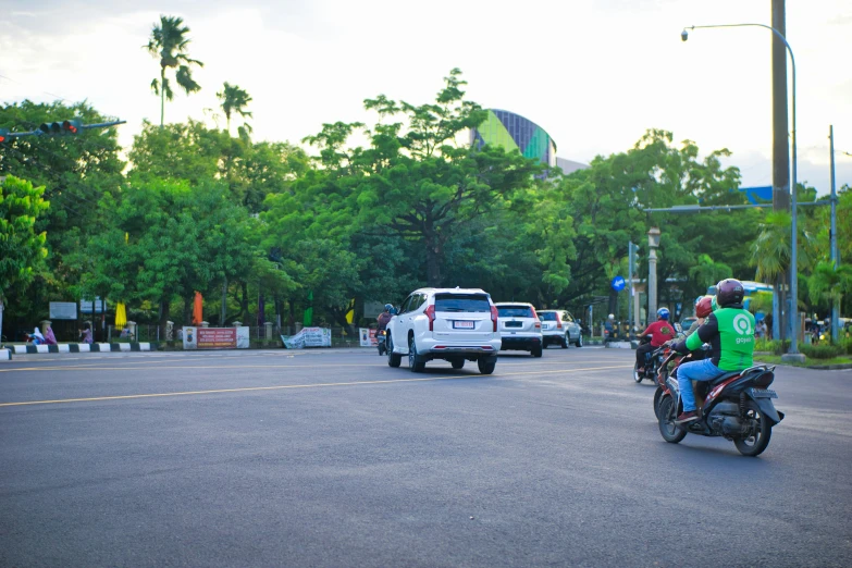 a street scene with several motorcycles in the foreground