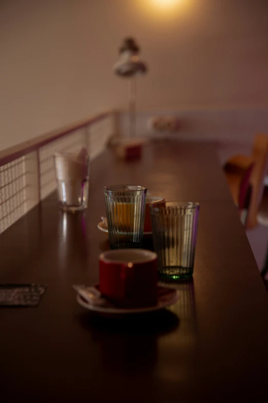 a table topped with cups filled with lots of liquid