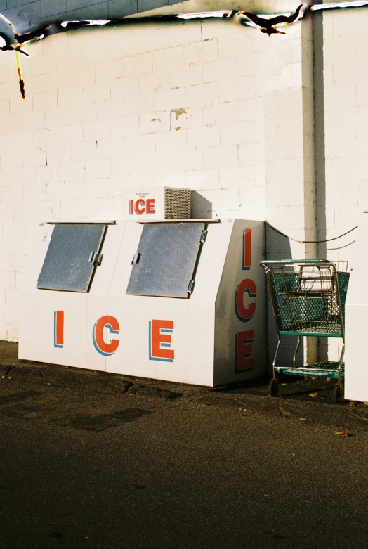 a white building with an ice machine by it