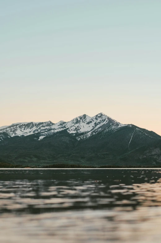 snowy mountain tops are visible from the lake