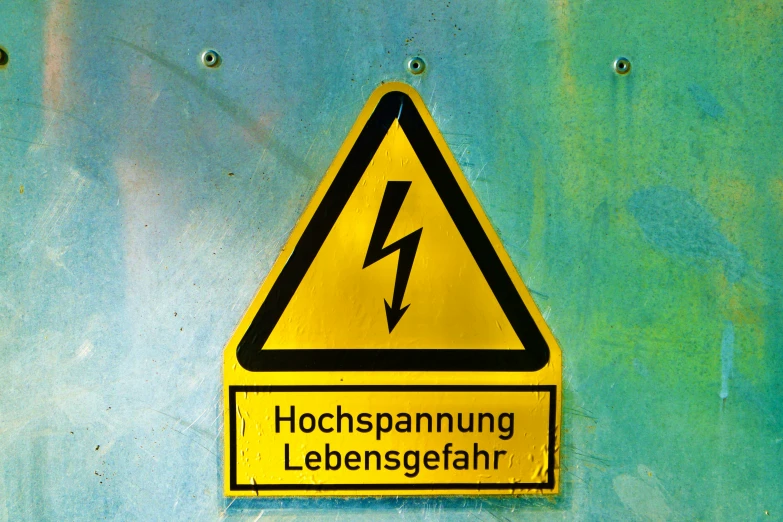 a sign on the back of a van has a lightening sign