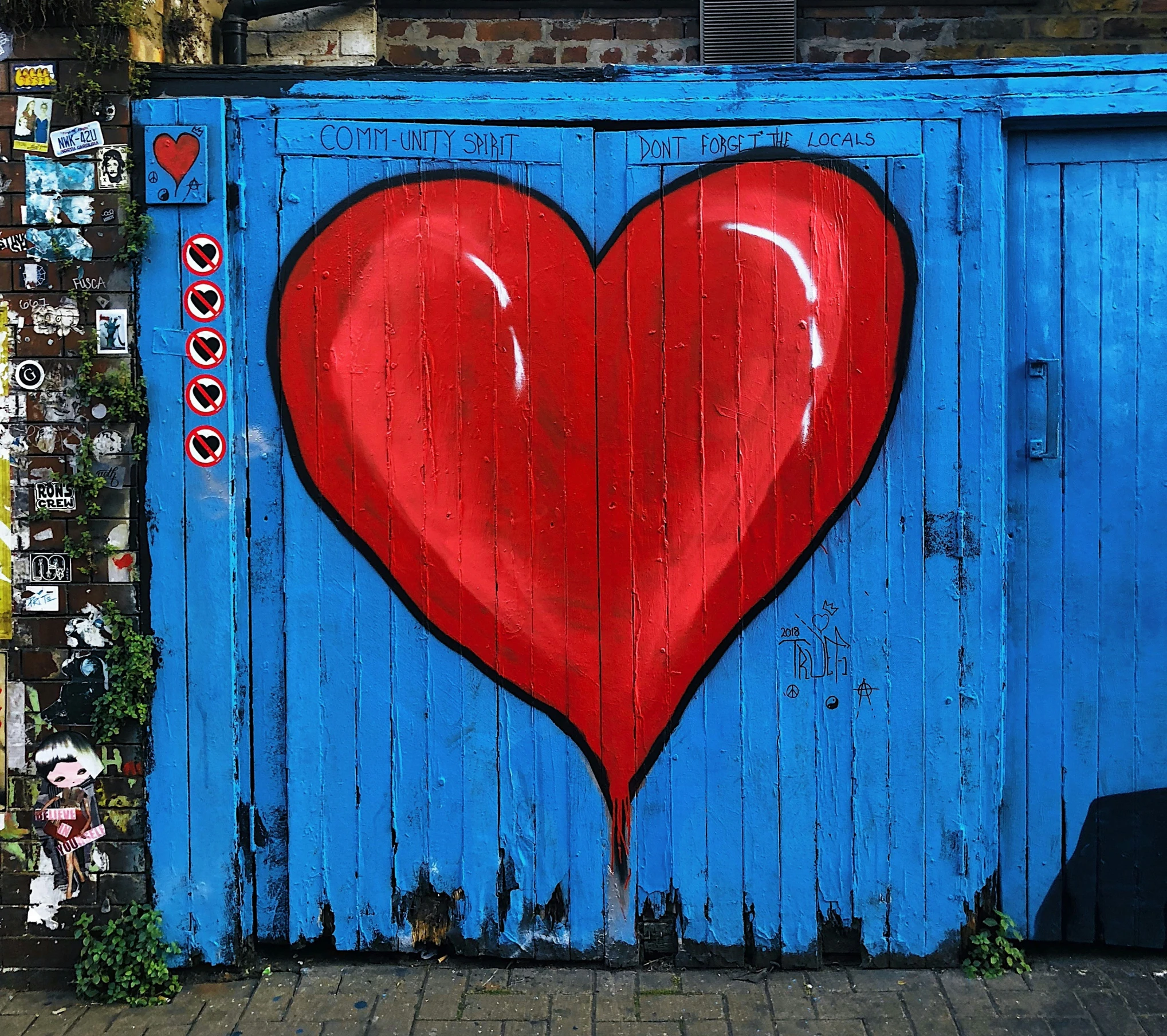 the heart on the blue door is a symbol of love