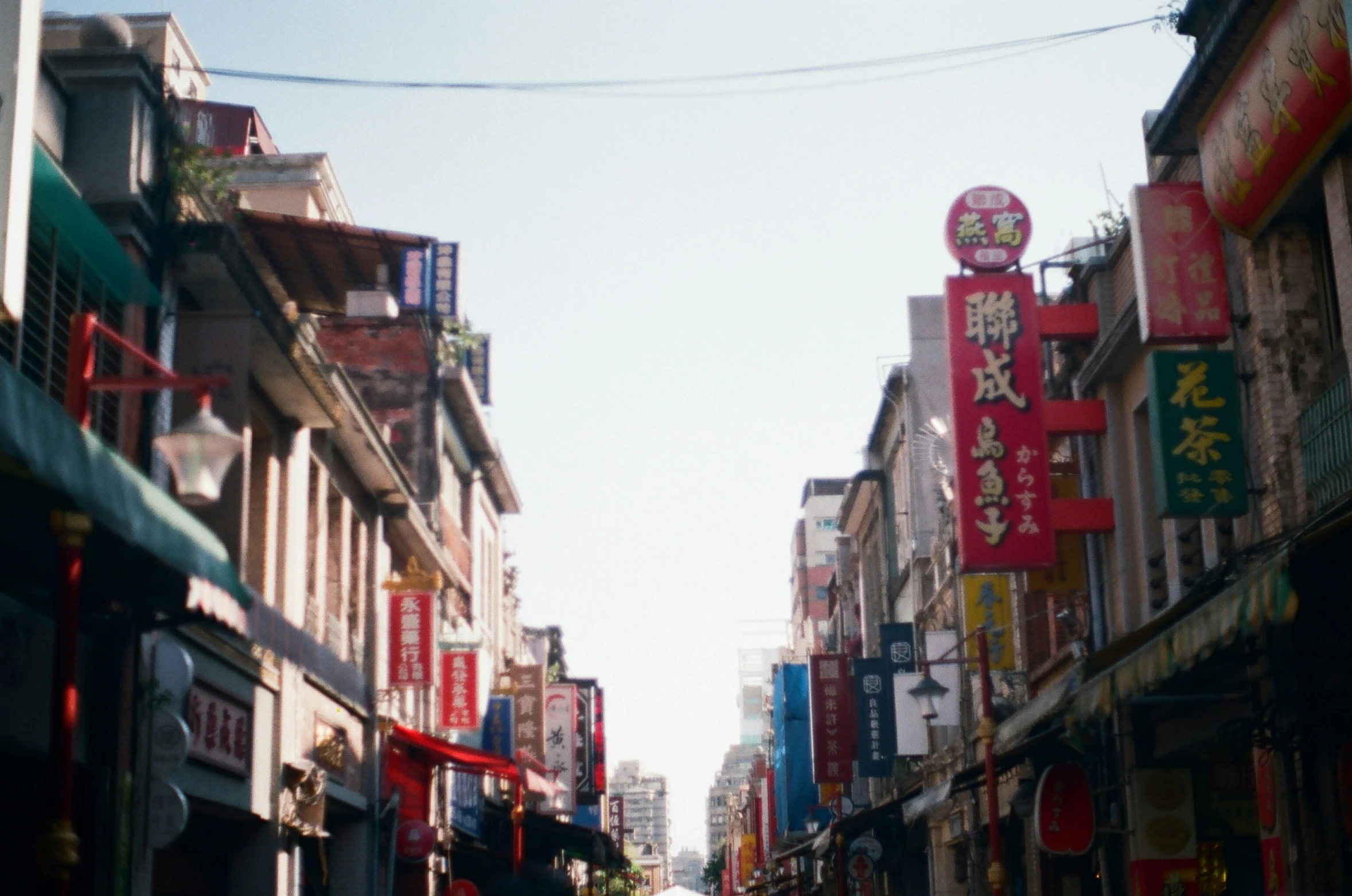 an old street that has many buildings lining the sides of it