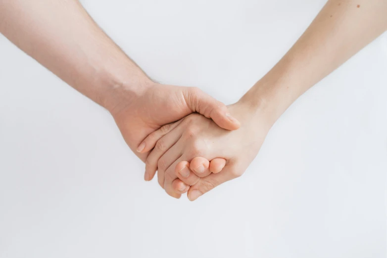 a woman holds the mans hand in an emce