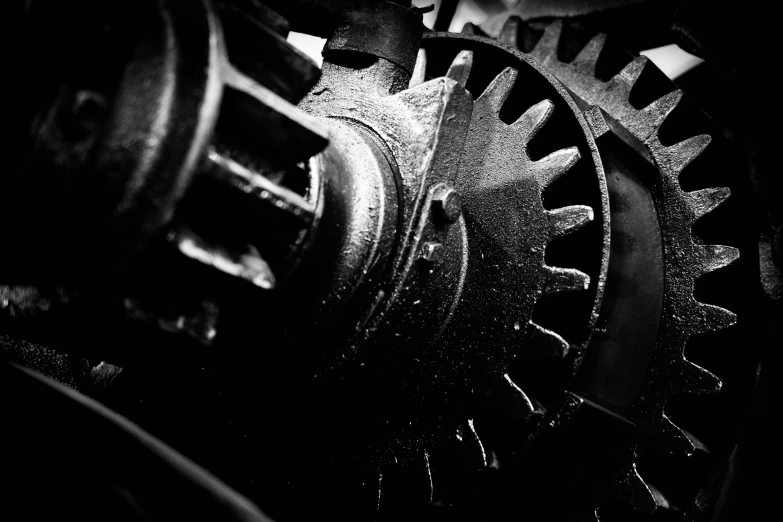 black and white pograph of gear wheels with different types of gears on them