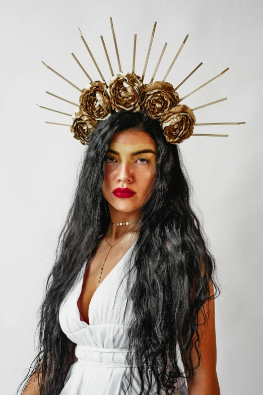 woman wearing a crown of golden metal flowers